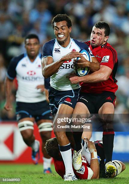 Ben Volavola of the Waratahs is tackled during the Super Rugby trial match between the Waratahs and the Crusaders at Allianz Stadium on February 14,...