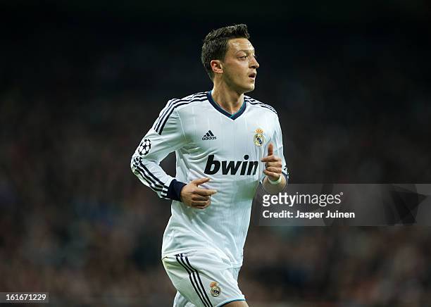 Mesut Ozil of Real Madrid looks on during the UEFA Champions League Round of 16 first leg match between Real Madrid and Manchester United at Estadio...