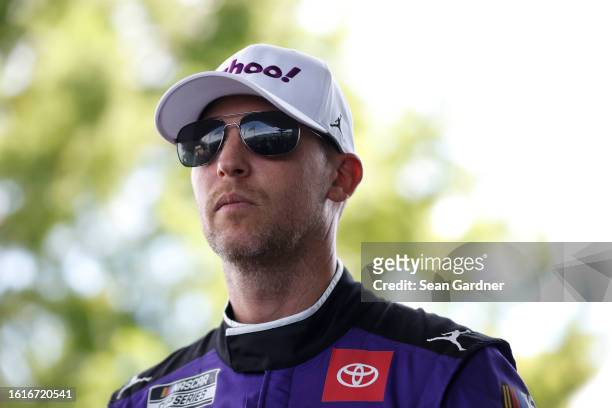 Denny Hamlin, driver of the Yahoo! Toyota, waits backstage during pre-race ceremonies prior to the NASCAR Cup Series Verizon 200 at the Brickyard at...