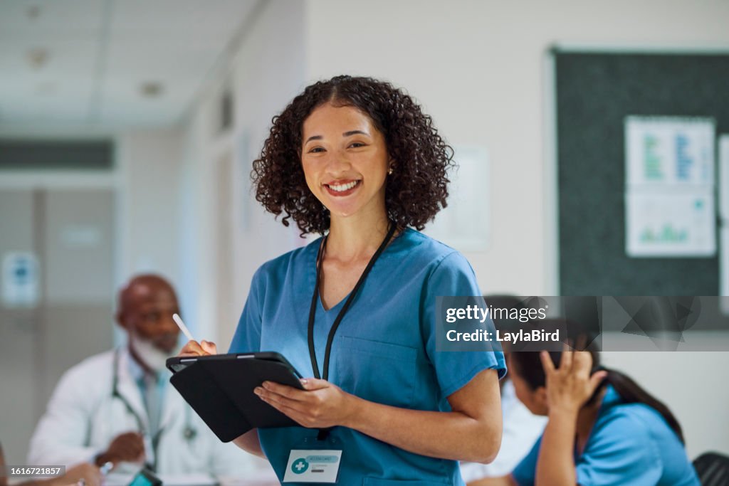 Nurse Using Camera Portrait Of Female Nurse Using Digital Tablet Smiling At Camera High ...