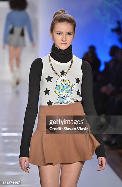 Model walks the runway at the Le Smurfette fall 2013 fashion show during Conair Style360 at Metropolitan Pavilion on February 13, 2013 in New York...