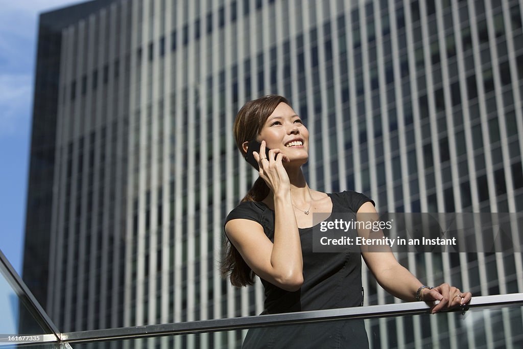 Woman listening to smartphone in city