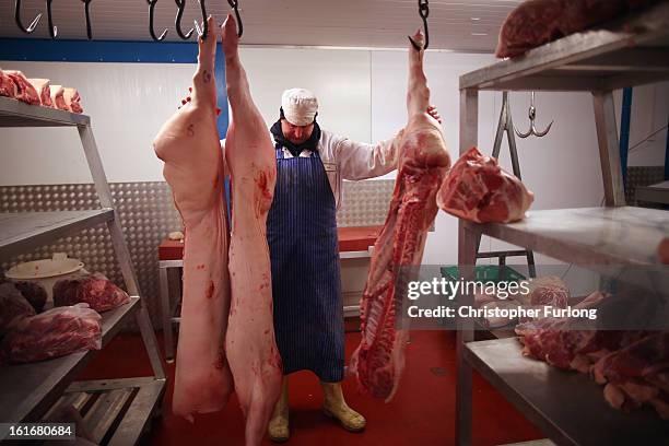 Cuts of meat hang inside a meat wholesalers at Liverpool Wholesale Meat Market on February 14, 2013 in Liverpool, England. British high street...
