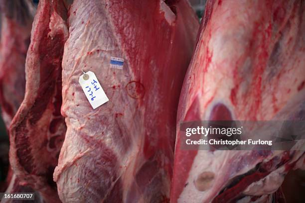 Cuts of beef hang inside a meat wholesalers at Liverpool Wholesale Meat Market on February 14, 2013 in Liverpool, England. British high street...