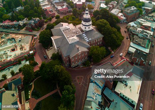 environmental degradation in urban areas: government house engulfed in smog against in downtown annapolis, md. drone view - annapolis stock pictures, royalty-free photos & images