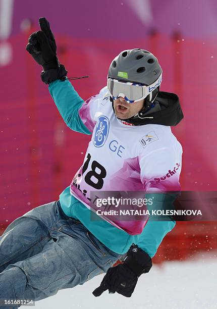 Slovenia's Rok Flander celebrates his third place at the Snowboard World Cup Men's Parallel Giant Slalom Test Event at the Snowboard and Freestyle...