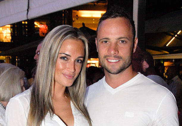 Picture taken on January 26, 2013 shows Olympian sprinter Oscar Pistorius posing next to his girlfriend Reeva Steenkamp at Melrose Arch in...