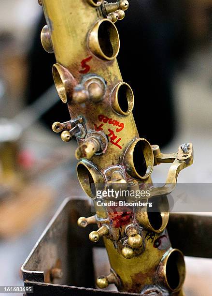Measurements on a saxophone mark the proper size for tuning holes at the assembly area in the manufacturing department of the E.K Blessing Co. In...