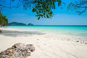 Beautiful tropical island white sand beach Andaman sea in blue sky sunny day.