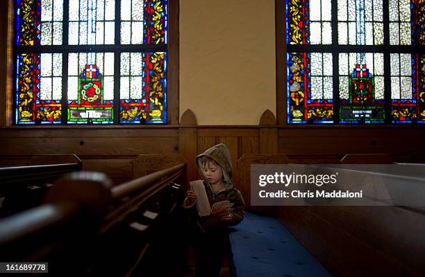 Milo Waterfall from Alexandria, Va., explores the Lutheran Church of the Reformation, near the U.S. Capitol, during a Moms Rising rally for "common...