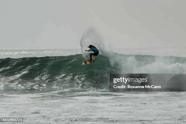 Hawaiian surfer Melanie Bartels is surrounded by ocean spray as she turns off the top of a wave at the 2005 Rip Curl Malibu Pro Surfing Contest...
