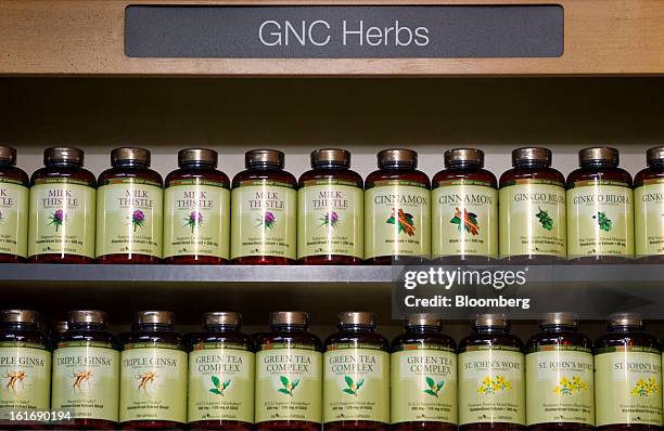 Bottles of GNC Holdings Inc. Herbal supplements are displayed for sale at a store in New York, U.S., on Thursday, Feb. 14, 2013. GNC Holdings Inc., a...