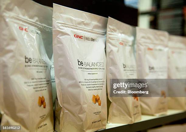 Bags of GNC Holdings Inc. Treats are displayed for sale at a store in New York, U.S., on Thursday, Feb. 14, 2013. GNC Holdings Inc., a retailer of...