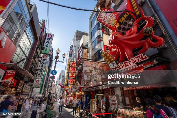 dotonbori in osaka, japan - takoyaki stock pictures, royalty-free photos & images