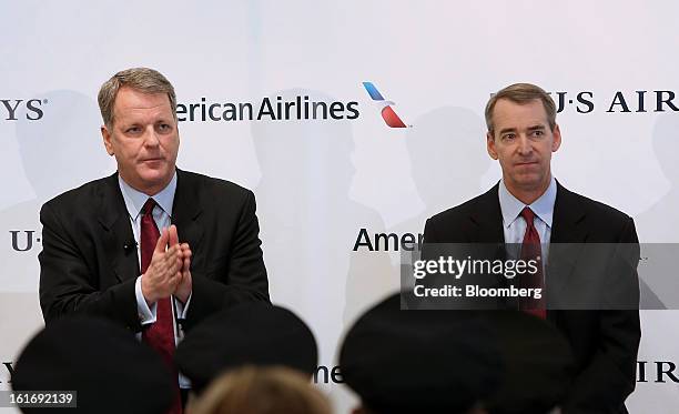 Doug Parker, chief executive officer of US Airways Group Inc., left, speaks while Tom Horton, president and chief executive officer of AMR Corp.'s...