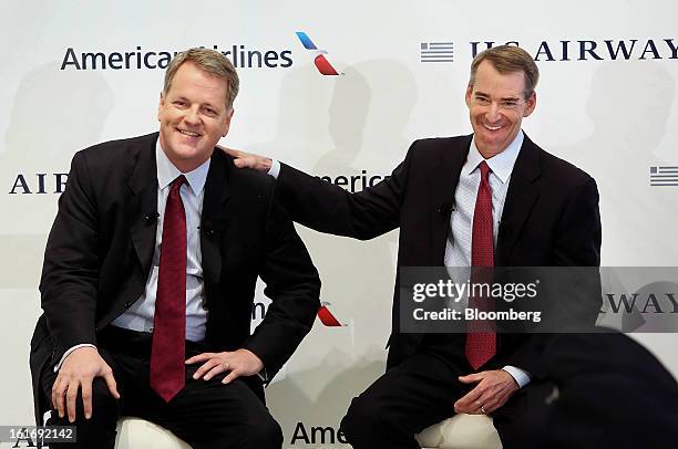 Doug Parker, chief executive officer of US Airways Group Inc., left, and Tom Horton, president and chief executive officer of AMR Corp.'s American...
