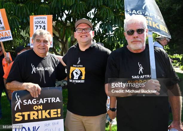 Dan Lauria, Duncan Crabtree-Ireland and Ron Perlman the SAG-AFTRA and WGA strike at Disney Studios on August 22, 2023 in Burbank, California.