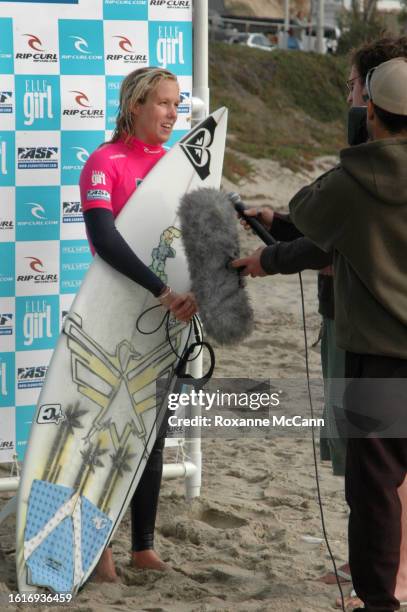 Australian surfer Chelsea Georgeson is interviewed at the 2005 Rip Curl Malibu Pro Surfing Contest wearing a black wetsuit with a hot pink shirt...