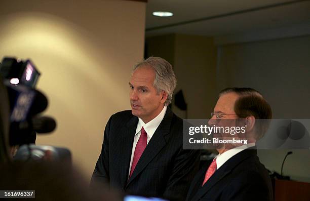 Alex Behring, managing partner at 3G Capital, left, speaks as Bill Johnson, chief executive officer of H.J. Heinz Co., laughs during a press...