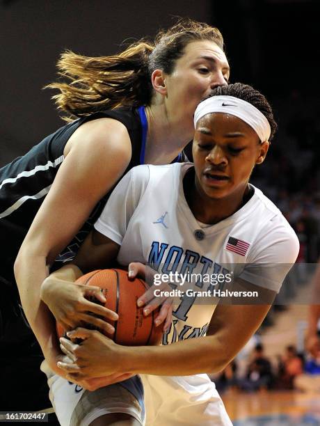 Haley Peters of the Duke Blue Devils battles for a rebound with Brittany Rountree of the North Carolina Tar Heels during play at Carmichael Arena on...