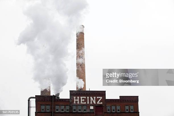 Smoke pours out of a stack at a H.J. Heinz Co. Production facility in Pittsburgh, Pennsylvania, U.S., on Thursday, Feb. 14, 2013. Warren Buffett’s...