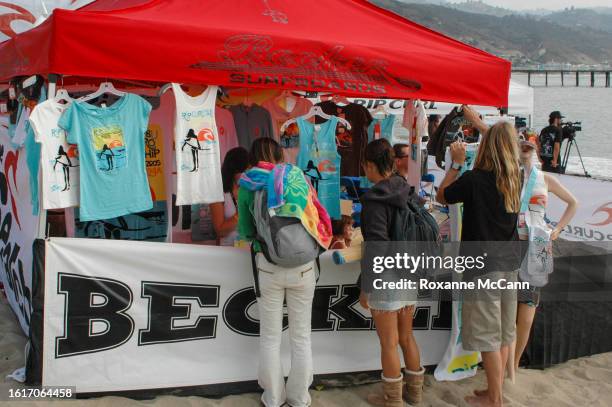 Malibu surf shop Becker, managed by surfer Mitch Taylor displays merchandise on the beach during the Rip Curl Malibu Pro Championship contest with a...