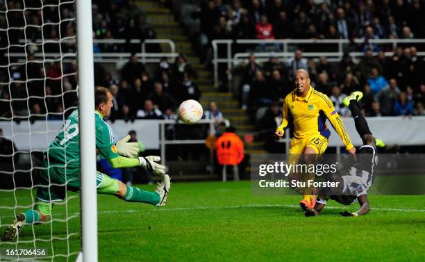 Newcastle player Papiss Cisse has his last minute header saved by goalkeeper Olexandr Goryainov during the UEFA Europa League Round of 32 first leg...