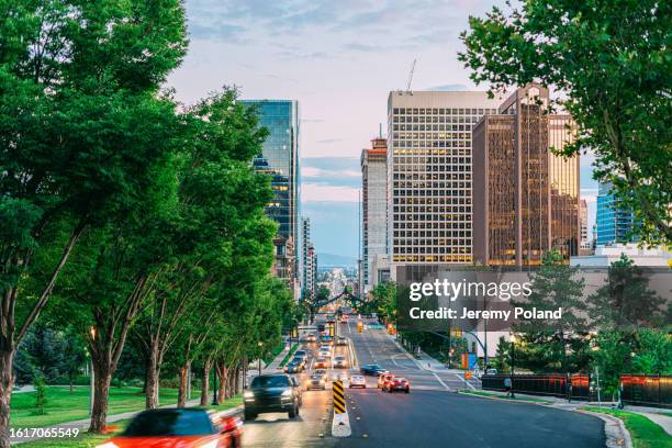 busy traffic in downtown salt lake city, looking south from n state street in the summer near temple square - salt lake city stock pictures, royalty-free photos & images