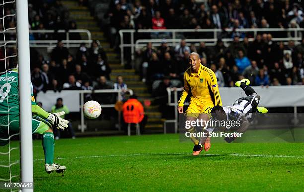 Newcastle player Papiss Cisse has his last minute header saved by goalkeeper Olexandr Goryainov during the UEFA Europa League Round of 32 first leg...