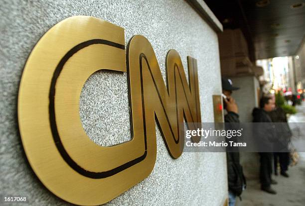 The CNN sign is seen outside its headquarters November 12, 2002 in New York City. The proposed merger between CNN and Walt Disney Co.'s ABC News is...