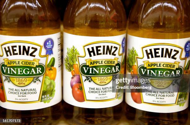 Bottles of H.J. Heinz Co. Apple cider vinegar are displayed on a shelf for sale at grocery store in Pittsburgh, Pennsylvania, U.S., on Thursday, Feb....