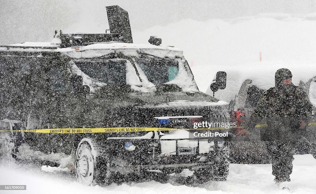 Search For Cop Killer Buffeted By Winter Storm