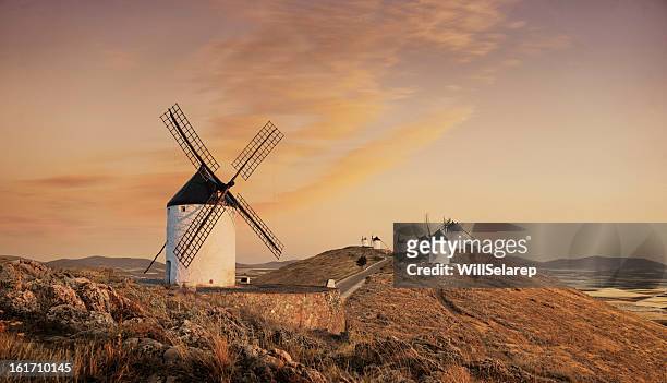 windmills at sunset, consuegra, castilla la mancha, spain - la mancha bildbanksfoton och bilder