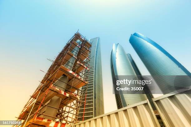 highrise construction site - abu dhabi building stock pictures, royalty-free photos & images