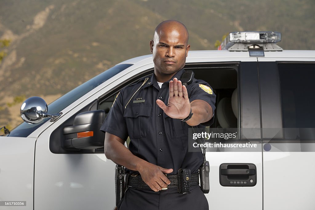 Police Officer Motioning to Stop