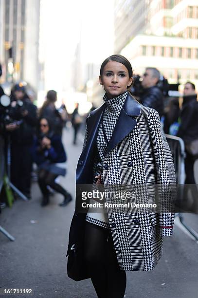 Miroslava Duma attends the Calvin Klein show wearing a Tommy Hillfiger jacket on February 14, 2013 in New York City.
