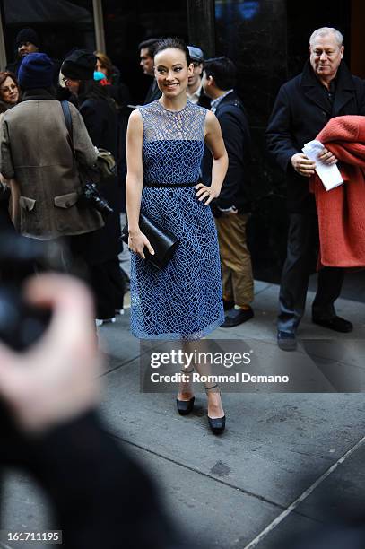 Olivia Wilde attends the Calvin Klein show wearing a Calvin Clein dress on February 14, 2013 in New York City.