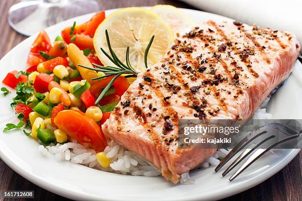 a grilled salmon followed by fresh rice and vegetables - salmon steak stock pictures, royalty-free photos & images