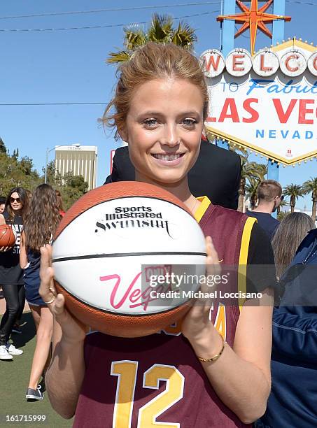 And Sports Illustrated Model Kate Bock support the NCAA Basketball Conference Championship at the historic Las Vegas sign on February 14, 2013 in Las...