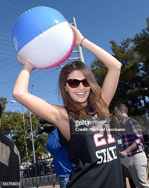 And Sports Illustrated Model Alyssa Miller support the NCAA Basketball Conference Championship at the historic Las Vegas sign on February 14, 2013 in...