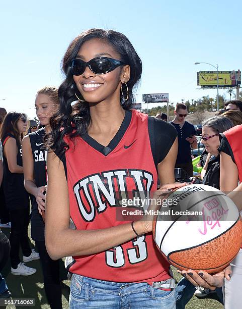 And Sports Illustrated Model Adaora support the NCAA Basketball Conference Championship at the historic Las Vegas sign on February 14, 2013 in Las...