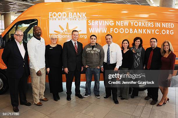 Model Jessica Hart with Mercedes-Benz Manhattan Volunteers unveil the Food Bank For New York City's Sprinter Van Donated By Mercedes-Benz Manhattan...