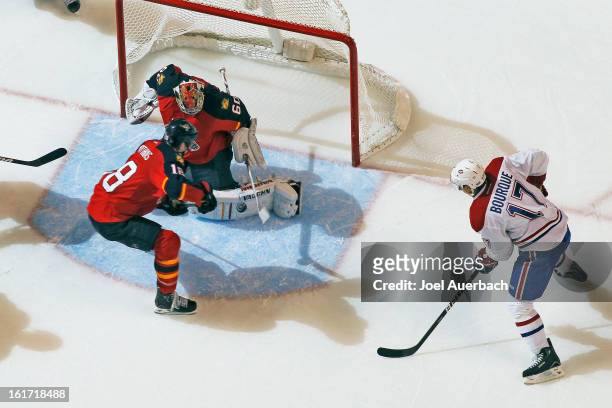 Rene Bourque of the Montreal Canadiens scores the overtime goal past goaltender Jose Theodore of the Florida Panthers at the BB&T Center on February...