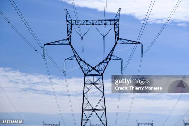 Electricity pylons bring electricity from the Gravelines Nuclear Power Station to the industry of the north of France on August 22, 2023 in...