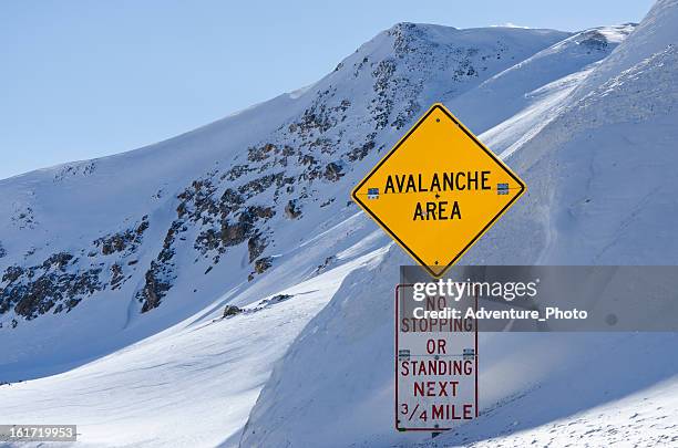 avalanche area sign - avalanche warning stock pictures, royalty-free photos & images