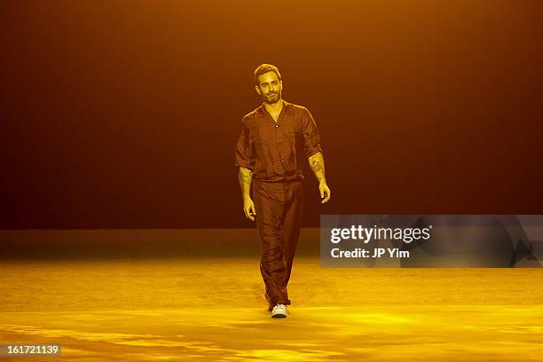 Designer Marc Jacobs walks the runway at the Marc Jacobs Fall 2013 fashion show during Mercedes-Benz Fashion Week at New York State Armory on...