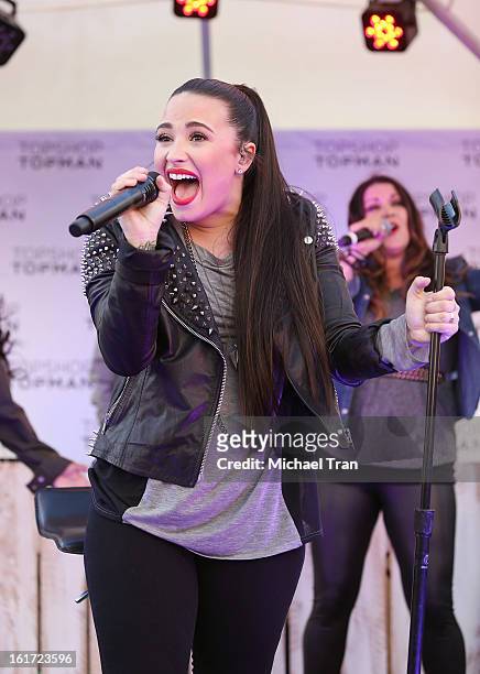 Demi Lovato performs at Topshop Topman LA Grand Opening at The Grove on February 14, 2013 in Los Angeles, California.