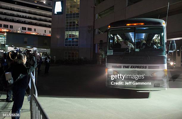 Passengers leave by bus from the crippled cruise liner Carnival Triumph February 14, 2013 in Mobile, Alabama. An engine fire on February 10 left the...