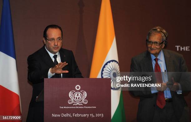 French President Francois Hollande speaks before awarding Indian Nobel laureate Amartya Sen France's highest civilian award, the Legion of Honour...