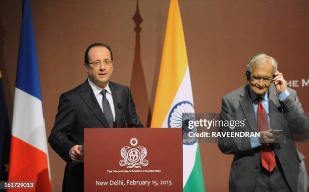 French President Francois Hollande speaks before awarding Indian Nobel laureate Amartya Sen France's highest civilian award, the Legion of Honour...